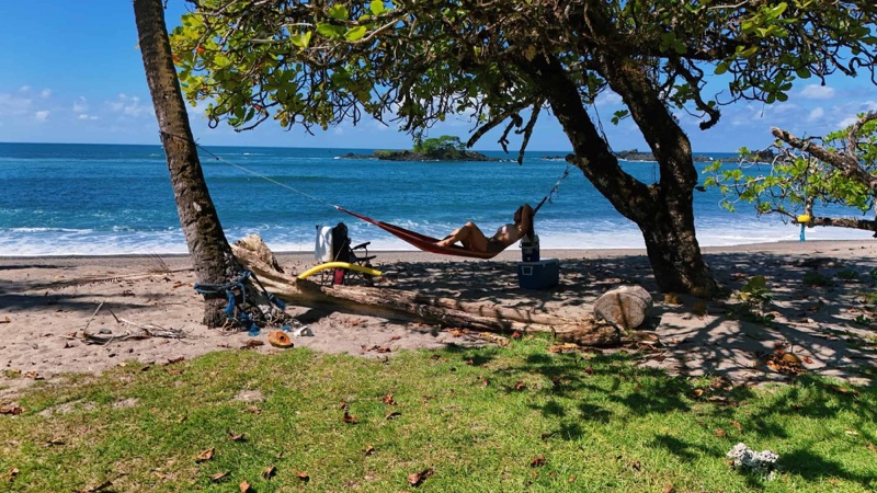 Hammock under trees on the beach in front of Copa de Arbol, near Drake Bay